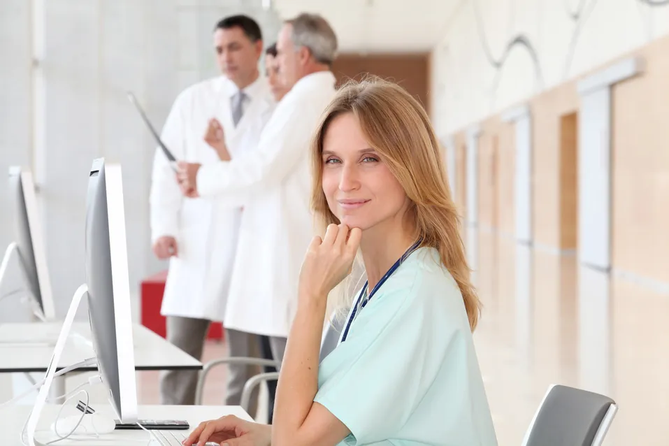 Healthcare worker at a computer, representing medical coding careers in Louisiana